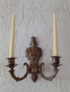 This stunning silver-plated brass candle holder is beautifully ornate and heavy, designed to hold taper candles. It is in very good condition, adding a touch of elegance to any space. Dimensions:     Height: 27 cm     Width: 28 cm     Depth: 13 cm A perfect statement piece for your home décor! Vintage Wall Candle Holders, Gold Candle Sconces, Wall Mounted Candle Holders, Wall Candle, Vintage Wall Sconces, Wall Candle Holders, Brass Candle Holders, Candle Wall Sconces, Apartment Decor Inspiration