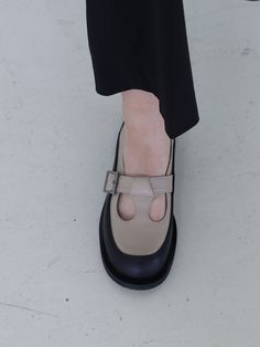 Editor's NoteMOL:pin presents sophisticated footwear that gives off a stylish mood.- Round shaped toe loafer- Unique T-strap on the instep- Soft and durable cow leather used- Color block design point- Comfortable to wearMeasurements(in.)- Size: KR 225MM (US 5.5) ~ KR 255MM (US 8.5)- Heel Height: 0.31 in. Composition & Care- Upper: Cow Leather / Lining: Pigskin- Natural leather may have fine scratches and wrinkles- Bright leather can get stained by denim or dark outfits- Pen and bon Leather Mary Janes With Branded Heel, Closed Toe Mary Janes With Rubber Sole For Office, Leather Mary Janes With Rubber Sole For Office, Office Leather Mary Jane Shoes With Almond Toe, Mary Jane Leather Shoes With Almond Toe For Office, Office Leather Mary Janes With Rubber Sole, Office Mary Jane Leather Shoes With Almond Toe, Pointed Toe Calf Leather Monk Strap Shoes For Work, Leather Mary Janes With Flat Heel For Office