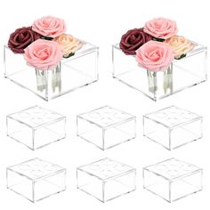 six clear vases with pink and red roses in them