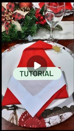 a table setting with red and white napkins