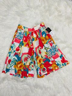 These vintage culottes are just absolutely fabulous! They are new old stock. They are a size 8 and the waist has elastic at the back. They have pockets. Please see photos for measurements. I ship next day! Enjoy! Retro Bottoms With Built-in Shorts For Spring, Retro High Waist Multicolor Shorts, Retro Bottoms With Built-in Shorts For Swimming, Vintage Multicolor Short Bottoms, Vintage Culottes, Retro Multicolor Cotton Shorts, Tankini Swimsuits, Absolutely Fabulous, Photo Craft