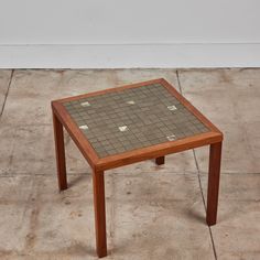 a small table made out of tiles on the ground