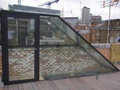 a glass enclosed area on top of a building