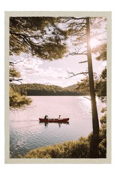 two people in a canoe on a lake