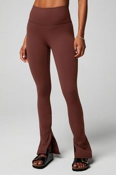 Define PowerHold® Split Hem Legging - Fabletics Fitted Brown Activewear For Fall, Fitted Mid-rise Activewear For Fall, Brown Workout Bottoms For Fall, High Stretch High-cut Leggings For Fall, High-cut High Stretch Leggings For Fall, Fitted Mid-rise Leggings For Fall, Trendy Fitted Yoga Pants For Fall, Fitted Bottoms For Fall Workout, Brown Yoga Pants For Fall