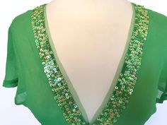 "Original Early 90s Vintage lovely Antik Batik Spring Green Pure Sheer Silk Crepe de Chine Sequinned Mardi Gras Festival Top, St Pat's wear, St Patrick's top blouse, Mother's Day gift, Easter outfit. Tag says size S but please check out measurements below as vintage sizes differ. Measurements: Shoulders 15\" Chest 34\" Waist 32\" Length 28 1/2\" Excellent condition, no issues. No real signs of wear or faults that I can see, all delicate and pretty sequins intact. I ship the same or the next day Festive Green Sequined Tops, Festive Green Sequin Tops, Green Sequined Party Blouse, Fitted Green Sequined Blouse, Festive Green Sequined Blouse, Green Sequined Blouse For Evening, Festive Green Sequin Blouse, Fitted Green Top For Holiday, Fitted Green Top For The Holiday Season