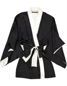 The luxurious black silk satin kimono by Helen Sanchez has full sleeves, a long sash belt and is trimmed with ivory silk. - Approximately 31" from shoulder to hem - 95% silk, 5% Lycra - Made in New York Luxury Silk Kimono For Evening, Elegant Long Sleeve Robe For Night Out, Elegant Long Sleeve Kimono For Night Out, Evening Kimono With Satin Finish, Evening Kimono With Satin Finish And Kimono Sleeves, Chic Satin Wrap Kimono, Luxury Long Silk Kimono, Elegant Satin Finish Kimono For Party, Black Silk Kimono For Spring