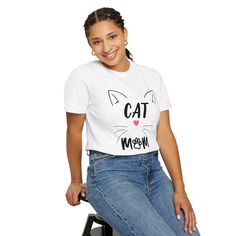 Are you a proud cat mom with a fierce feline spirit? Then this T-shirt is perfect for you! Show off your love for your fur babies with this adorable CAT MOM WITH WHISKERS T-shirt. Get your CAT MOM WITH WHISKERS T-shirt today and let the world know how much you love your fur babies! Comfort Colors introduces the "Comfort Colors 1717" garment-dyed t-shirt; a fully customizable tee made 100% with ring-spun cotton. The soft-washed, garment-dyed fabric brings extra coziness to your wardrobe while the Trendy Crew Neck T-shirt With Cat Design, Relaxed Fit Short Sleeve T-shirt With Cat Print, Relaxed Fit Graphic Tee With Cat Design, Trendy Cotton Tops With Cat Design, Trendy Cotton Top With Cat Design, Relaxed Fit Short Sleeve T-shirt With Cat Design, Trendy Relaxed Fit Top With Cat Design, Trendy Relaxed Fit Top With Cat Print, Trendy Relaxed Fit Cat Print Tops