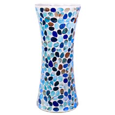 a vase with blue and brown dots on it