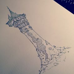 a drawing of the eiffel tower is shown in blue ink on white paper