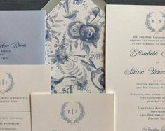 the wedding stationery is laid out on top of each other, with matching envelopes