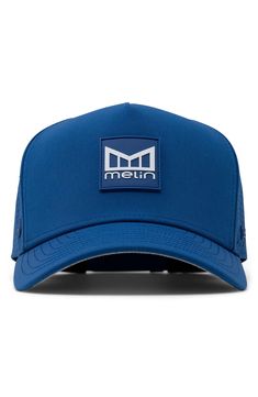 a blue hat with the word m e n in white letters on it, and an emblem