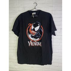 Up For Grabs Is A Brand New Marvel Comics Venom Short Sleeve Logo Graphic Tee T-Shirt Black Red Men's Size Large. Never Worn Or Used. Measurements Laying Flat Are Included In Photos. Please Refer To All Photos. Ask Any Questions Prior To Purchasing. Thanks! Black Pop Culture T-shirt For Comic-con, Black T-shirt With Graphic Print For Comic-con, Crew Neck T-shirt For Comic-con Streetwear, Black T-shirt For Comic-con, Casual T-shirt For Comic-con, Black T-shirt For Comic-con Fan Gear, Black T-shirt For Comic-con Fan Merchandise, Comic-con Fan Merchandise Black T-shirt, Black Graphic T-shirt For Comic-con