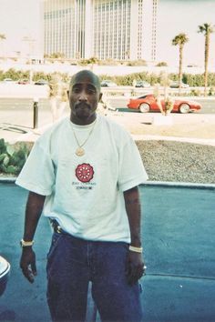 a man standing in front of a parking lot