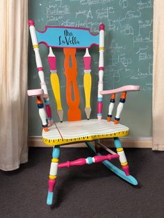 a child's rocking chair made out of crayons and chalkboard with writing on it