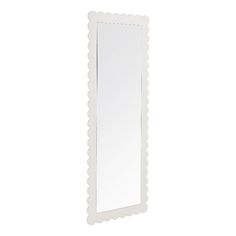 a white framed mirror with scalloped edges