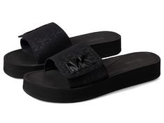 MICHAEL Michael Kors MK Platform Slide - Women's Shoes : Black : Your friends will want to copy your style when they see you wearing the MICHAEL Michael Kors MK Platform Slide, with the large MK logo print on beautiful canvas material, a cushioned platform that will have your feet thanking you for all that comfort, and a open-toe slide on style sandal for easy on/off. Textile upper with a hook-and-loop closure. Rhinestone embellishment to add some sparkle to your day. Textile lining. Synthetic i Michael Kors Casual Platform Sandals, Michael Kors Formal Platform Sandals, Michael Kors Black Round Toe Sandals, Michael Kors Open Toe Platform Sandals, Michael Kors Black Leather Sandals, Mk Sandals, Michael Kors Slides, Mk Shoes, Platform Slides