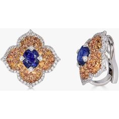 Looking for the perfect gift for your significant other? Look no further than these stunning Pacha earrings from Piranesi. With a total carat weight of 4.45, these earrings feature a breathtaking combination of blue and orange sapphires and white diamonds, set in 18K white and rose gold. The oval blue sapphire is the focal point of each earring, while the round orange sapphire and white diamonds add the perfect touch of sparkle and contrast. These earrings are sure to turn heads and make your lo Luxury Multi-stone Diamond Earrings For Formal Occasions, Luxury Multi-stone Earrings For Formal Occasions, Luxury Multi-stone Diamond Earrings For Anniversary, Elegant Multi-stone Diamond Earrings, Multi-stone White Gold Earrings For Formal Occasions, Luxury Multi-stone Diamond Earrings, Elegant Oval Multi-stone Earrings, Formal Multi-stone Diamond Earrings, Formal Multi-stone Fine Jewelry Earrings