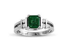 Emerald and Diamond Ring in 14k White Gold. The diamonds have a total carat weight of 0.10 carats. Formal Emerald Diamond Ring With Vvs Clarity, Hallmarked Emerald Cut Diamond Ring, Emerald Cut Hallmarked Diamond Ring, Formal 14k White Gold Ring With Asscher Cut, Formal 14k Gold Emerald Ring With Diamond Accents, Classic Emerald Diamond Ring With Brilliant Cut, Platinum Solitaire Emerald Ring For Formal Occasions, White Gold Brilliant Cut May Birthstone Ring, May Birthstone Ring In Brilliant Cut White Gold