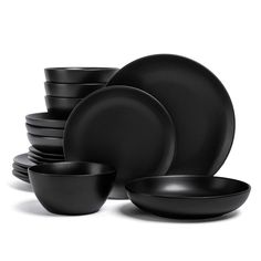 black dinnerware is stacked on top of each other