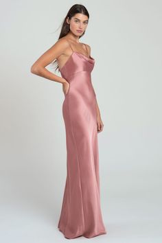 a woman in a long pink dress