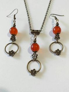 Carnelian Victorian Antique bronze jewelry set hoop necklace earrings Boho set bronze Carnelian set orange-red jewelry Carnelian earring Carnelian flowers jewelry gift set Carnelian Victorian set flowers necklace earrings Bohemian necklace and earrings . Beautiful Set of bronze-tone ornament flowers beads and hoops and Genuine Carnelian necklace and earrings. Bronze-tone Victorian style necklace and earrings. Boho necklace. Bohemian necklace and earrings. Romantic necklace and earrings. Beautifu Nickel-free Carnelian Jewelry, Antique Orange Jewelry With Natural Stones, Antique Round Orange Jewelry, Antique Orange Round Jewelry, Handmade Vintage Jewelry Sets As Gift, Handmade Vintage Jewelry Sets For Gift, Orange Round Pendant For Jewelry Making, Orange Vintage Copper Jewelry, Antique Bronze Jewelry