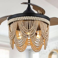 a chandelier with beads hanging from the ceiling