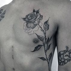 a man with a rose tattoo on his chest