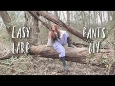 a woman sitting on top of a fallen tree in the woods with words over her