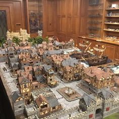 a model town with lots of wooden buildings