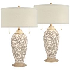 two white ceramic lamps with beige shades