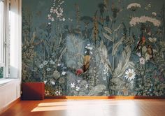 a room with flowers and birds painted on the wall