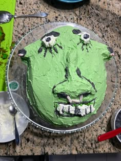 there is a green cake that looks like a face