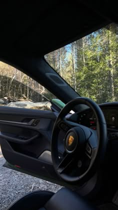 the interior of a car is shown with dashboard and steering wheel, as seen from inside