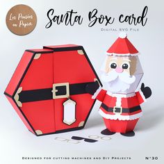 an origami santa box card is shown next to it's cardboard holder