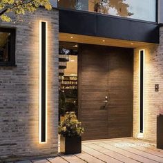 the entrance to a modern home is lit up with leds and lights on it