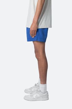 the Summer Shorts are constructed with a polyester fabric in a relaxed fit. The shorts feature an elasticized waist, welt pocket, and finished with a contrasting drawcord with a metal aglets. details elasticized self waist with drawstring relaxed fit 100% polyester model is 5’11, 140 lbs and wears a size medium Casual Blue Swim Trunks With Built-in Shorts, Sporty Blue Swim Trunks With Built-in Shorts, Casual Shorts With Elastic Side Panels, Spring Casual Shorts With Elastic Side Panels, Casual Cotton Shorts With Elastic Side Panels, Casual Spring Shorts With Elastic Side Panels, Blue Cotton Pull-on Shorts, Blue Athleisure Bottoms With Elastic Side Panels, Casual Summer Athletic Shorts With Elastic Side Panels