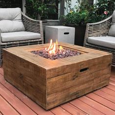 a fire pit sitting on top of a wooden deck