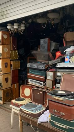 many suitcases are stacked up in the garage