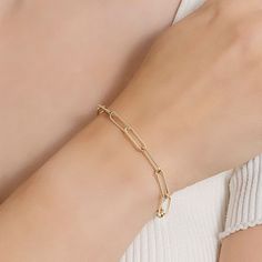 Add a trendy look to your jewelry collection by adding this Silver Reflections 14K gold over brass paperclip chain bracelet. This bracelet is crafted in 14K gold over brass, available in 7.25 inches length, has a solid paperclip chain construction and features a lobster clasp closure for a safe and comfortable wear. If you're looking for the perfect trendy chain bracelet for stacking or to wear alone, this bracelet is just what your jewelry collection needs! Wipe bracelet clean with a soft cloth Gold-tone Paperclip Bracelet With Rectangular Links, Modern Gold Chain Bracelet With Paperclip Chain, Gold Paperclip Box Chain Bracelet, Gold Minimalist Paperclip Bracelet With Box Chain, Modern Gold Plated Paperclip Chain Bracelet, Minimalist Gold Paperclip Bracelet With Box Chain, Gold-tone Minimalist Gold-plated Paperclip Bracelet, Dainty Gold Paperclip Bracelet With Solid Links, Minimalist Gold-tone Gold-plated Paperclip Bracelet