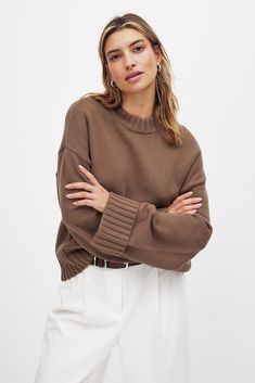 This sweater features a stretchy knit material and an oversized fit. It has wide, folded long sleeves and a ribbed round neck. Our sweater has ribbed hems. Brown Oversized Open Knit Sweater, Fall Ribbed Cuff V-neck Loungewear Sweater, Fall Long Sleeve V-neck Sweater With Ribbed Cuffs, Fall Wool V-neck Sweater With Ribbed Cuffs, Brown Textured Knit V-neck Sweater, How To Fold Sleeves, Oversize Pullover, Jeans Rock, Business Outfit