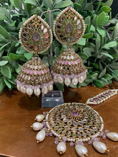 Top class mirror work. Brass base , antique platting , silver mirror and colored bead work. Jhumka is about 5 inch long and Tikka is 3 inch long and 2.75 inch wide. Bohemian Kundan Danglers With Stone Work, Festive Temple Jewelry Danglers With Mirror Work, Bohemian Kundan Chandbalis With Stone Work, Festive Chandbali Jhumkas With Mirror Work, Traditional Mirror Work Earrings For Festival, Silver Temple Jewelry Jhumkas With Mirror Work, Bohemian Danglers With Mirror Work For Festive Season, Party Kundan Jhumkas With Mirror Work, Kundan Jhumkas With Mirror Work For Party