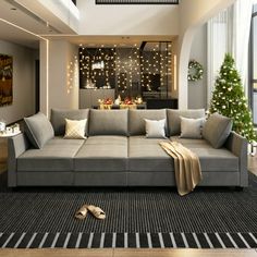 a living room filled with furniture and christmas decorations