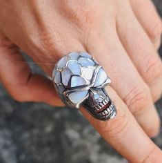 Handmade Exclusive Massive Skull Ring Pure 925 Sterling Silver with Natural Mother of pearl This beautiful Skull Ring has been Fabulously cast with .925 Sterling Silver and set with Hand Shaped Natural Mother of Pearl. The weight of this ring is 27 Grams The Ring size is 9 1/2 US. We will resize any size per your request. Please allow 2-3 weeks shipping as we are in Bangkok Thailand at this time We are a Los Angeles based company operating out of Thailand so that we may bring you the highest quality items at the most competitive prices. Just search and compare. We only offer authentic items. What we describe in our listings is 100% accurate and we encourage all of our customers to authenticate their purchases. USA please allow 14-21 business days Europe and U.K please allow 14-21 business Handmade White Gold Skull Ring Gift, White Sterling Silver Skull Jewelry, White Skull-shaped Sterling Silver Jewelry, Unique Silver Skull Ring Hallmarked, Silver Skull Ring With Gemstone For Gift, Handmade Skulls, Mother Of Pearl Inlay, Pearl Inlay, Skull Jewelry