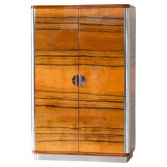 a wooden cabinet with metal handles and drawers