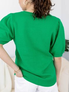 This short sleeve knit sweater features a puff sleeve accent to add a stylish, feminine flair to the look. Sequins make up a script LUCKY and four leaf clover sitting front + center, making this a super cute and fun way to style your St. Patricks Day attire! Sequin accent St. Patricks Day inspired Puff sleeve silhouette Short sleeve sweater silhouette 100% Acrylic Body length measurement: 26" from a S. Bust measurement: 19" from a S. Model is wearing a S. // { const scriptElement = document.querySelector('script[data-lyvecom]'); scriptElement.addEventListener('load', () => { LyveComWidget.mountCarouselComponent({ carouselID: '65d778117957d5853f13e925', parentElement: '.lyvecom_carousel--component', carousel: true, bubbles:true, lng: 'en' }); })})() // ]]> Trendy Textured Knit Top With Puff Sleeves, Green Crew Neck Chic Knit Top, Chic Green Crew Neck Knit Top, Solid Color Cotton Puff Sleeve Top With Crew Neck, Solid Cotton Puff Sleeve Top With Crew Neck, Trendy Knit Top With Puff Sleeves, Textured Knit Puff Sleeve Tops, Textured Knit Stretch Tops With Puff Sleeves, Textured Knit Stretch Top With Puff Sleeves