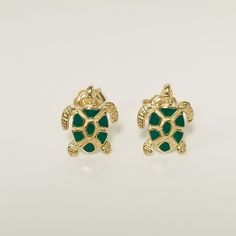 "Thanks for shopping our vintage estate store. We tend to sell well below wholesale and truly hope you enjoy all of our items. Many of the items are one of a kind, so please enjoy scrolling through the pictures and hopefully something will catch your eye. Brown spots are from camera. Beautiful estate 10k yellow gold sea turtle green enameled studs. Size: 8mm by 11mm 3/8\" Weight: .50 gram Carat: .025 per stud Marked 10k and they are sweet studs. As with most estate items there may be some wear on item. We do not sell new items, nor do we charge new retail prices." Classic Gold Enamel Earrings, Gold Enamel Clip-on Earrings, Classic Green Enamel Jewelry, Green Enamel Clip-on Jewelry, Nickel-free Yellow Gold Enamel Jewelry, Nickel-free Yellow Gold Enamel Earrings, Hallmarked Gold Enamel Earrings, Yellow Gold Enamel Clip-on Earrings, Yellow Gold Clip-on Enamel Earrings