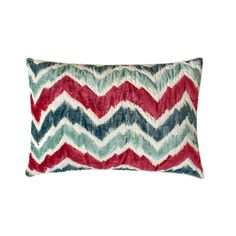 a red, white and blue chevroned pillow