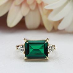 Rectangular Emerald Gemstone Rings, Anniversary Ring With Rectangular Emerald, Anniversary Emerald Ring With Rectangular Stone, Fine Jewelry Rectangular Emerald Ring, Emerald Rings With Prong Setting, Rectangular Shape, Classic Rectangular Emerald Gemstone Ring, Rectangular Emerald Ring With Accent Stones For Formal Occasions, Rectangular Emerald Ring With Accent Stones For Formal Events, Rectangular Emerald Ring With Prong Setting Gift