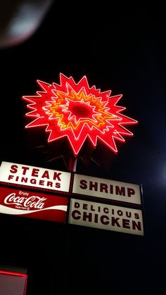 a neon sign that says steak fingers shrimp delicious chicken